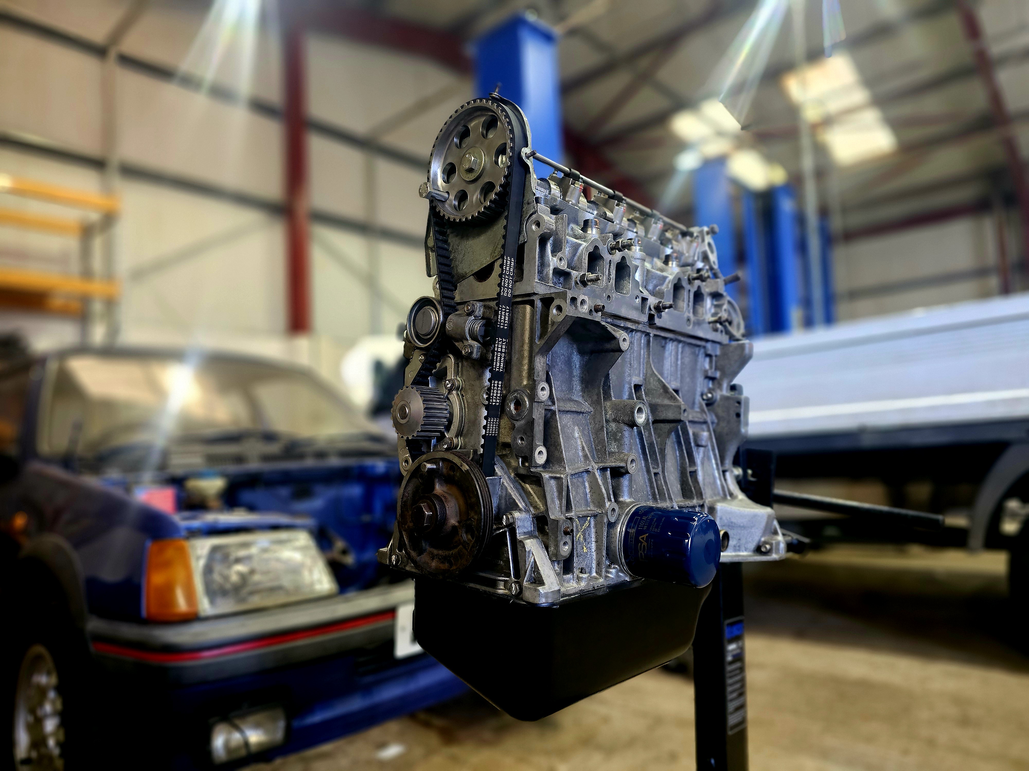 Detailed Peugeot XU-series engine bay and intake components